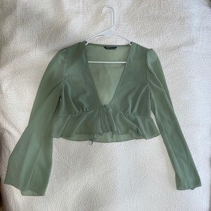 Cropped light green blouse